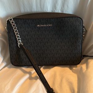 Jet Set bag black Used once. Purse was hanging in closet, see picture for strap
